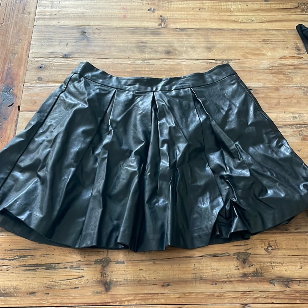 Black pleather pleated skirt. Size M.